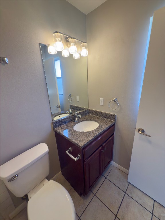 2012 Margalene Way, Unit B Austin, TX 78728 - Photo 12 of 14 a bathroom with a sink vanity mirror and toilet