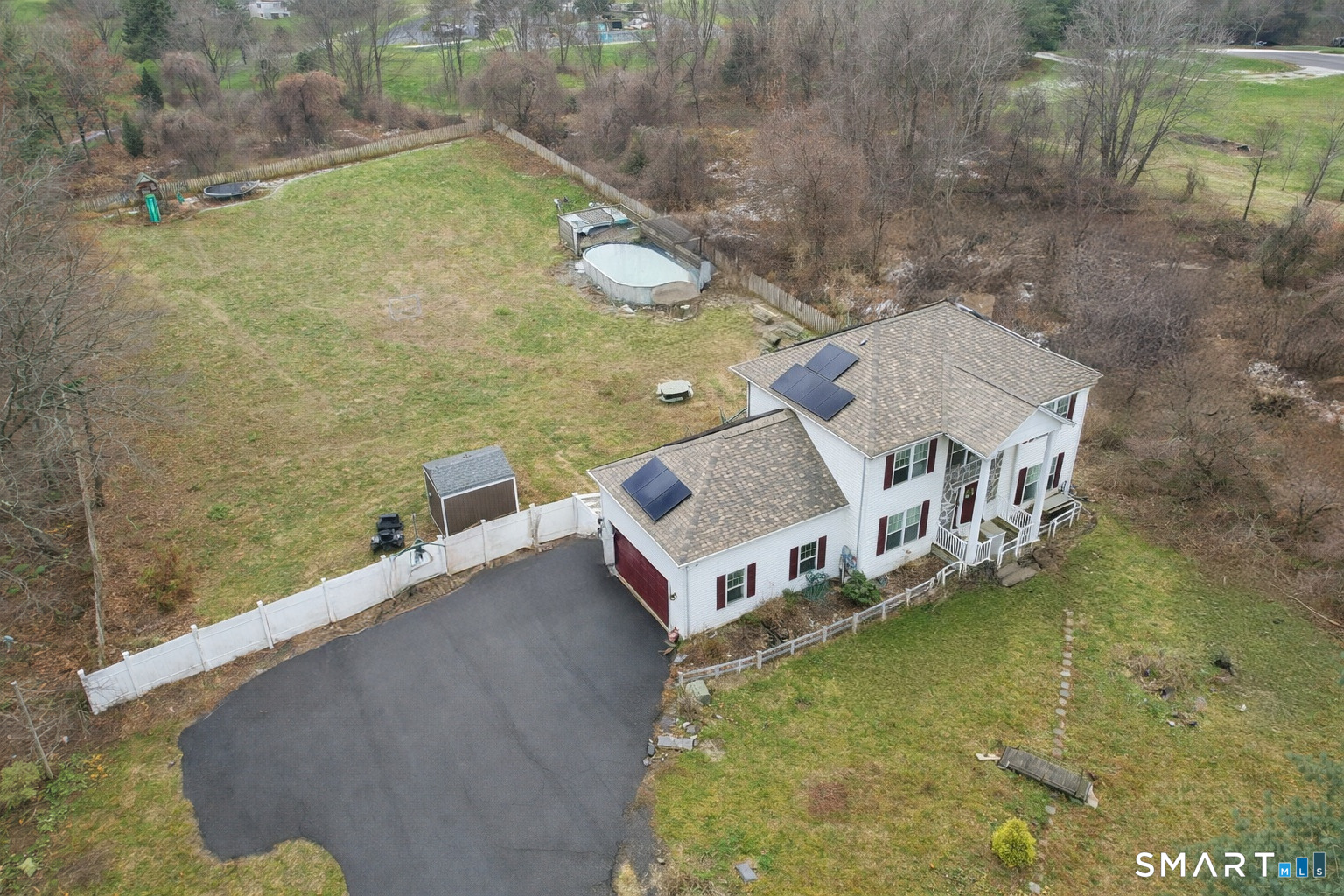 a aerial view of a house with a yard