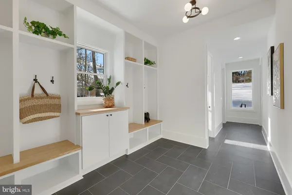 a living room with furniture a table and a fireplace