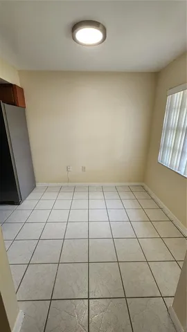 a kitchen with a sink stove and refrigerator