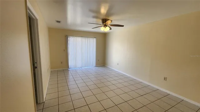 a view of an empty room and window