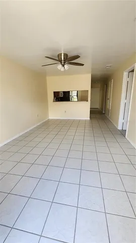 a kitchen with a sink a stove and cabinets
