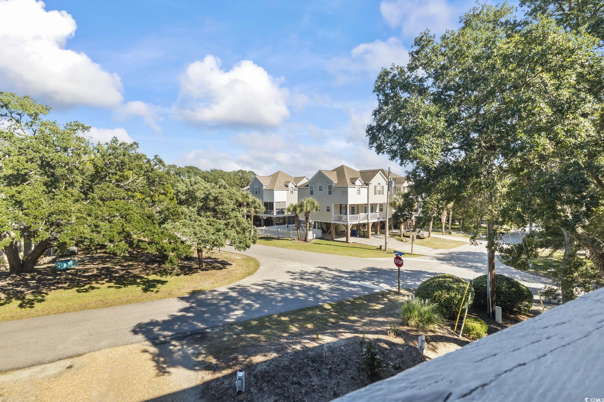 310 5th Avenue North, Unit 206 Surfside Beach, SC 29575 - Photo 32 of 40 View of road featuring traffic signs