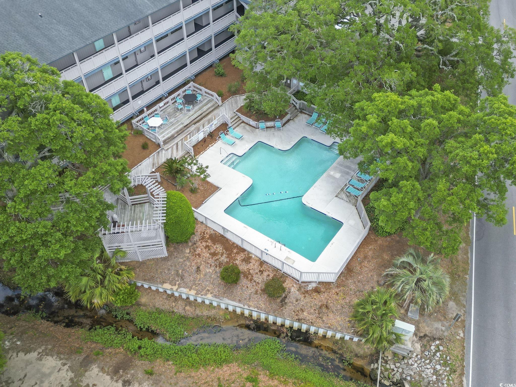 310 5th Avenue North, Unit 206 Surfside Beach, SC 29575 - Photo 38 of 40 Bird's eye view of a pool area