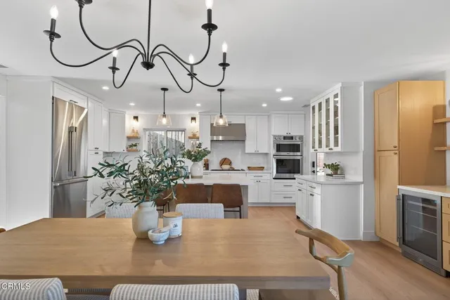a kitchen with stainless steel appliances kitchen island granite countertop a sink and cabinets