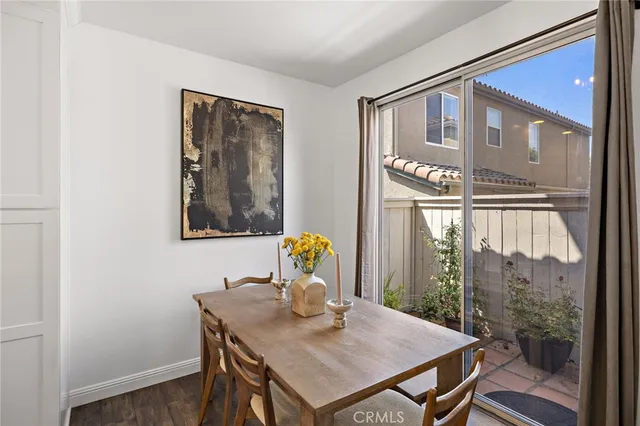 a view of a dining room with furniture and window