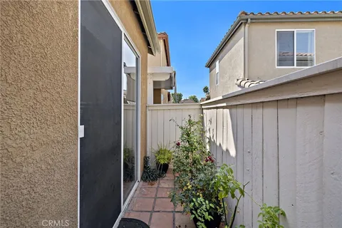 a bathroom with a potted plant and a window