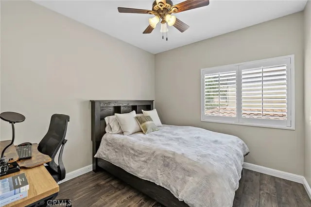 a bedroom with bed and window