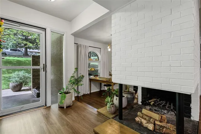 a dining room with furniture and wooden floor