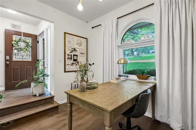 a view of a dining room with furniture window and wooden floor