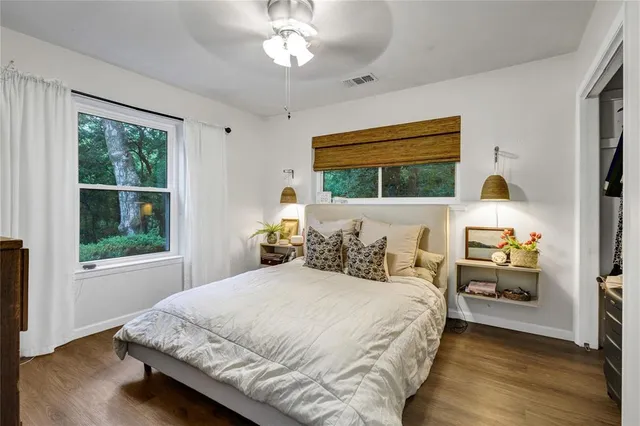 a bedroom with bed and window