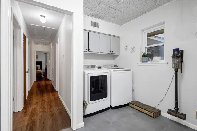 a view of a hallway with kitchen and entryway