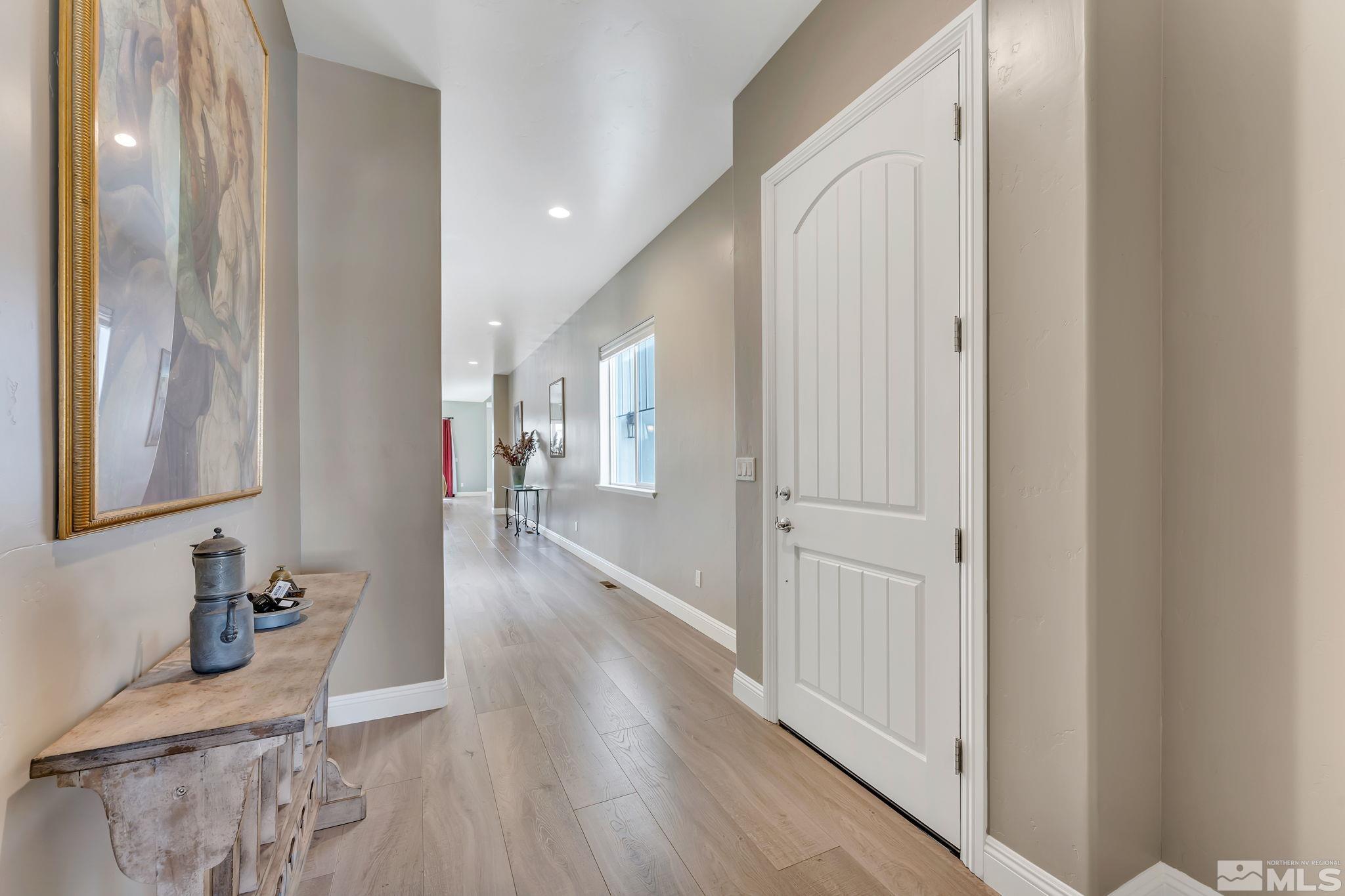 1559 Elk Run Trail Reno, NV 89523 - Photo 3 of 26 a hallway with wooden floor windows
