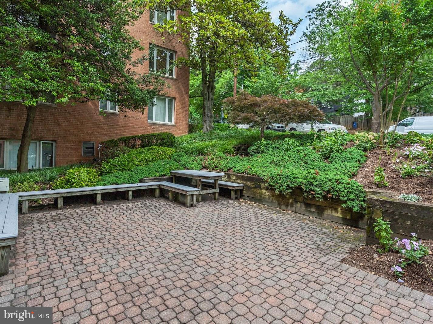 2400 41st Street Northwest, Unit 203 Washington, DC 20007 - Photo 21 of 24 front view of a house with a yard
