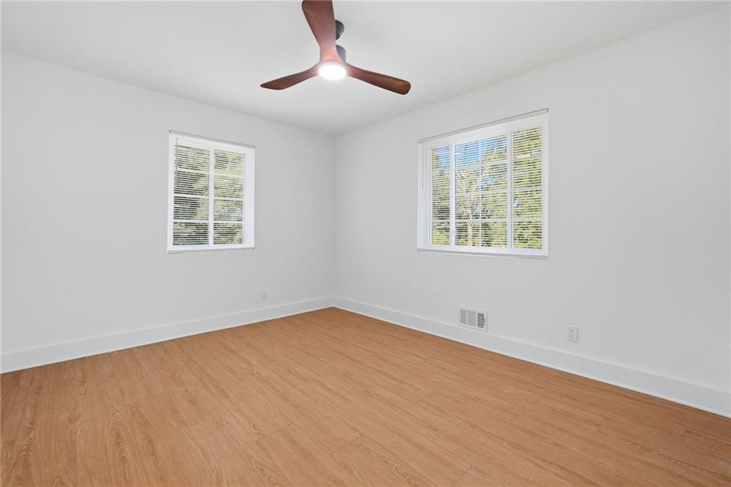 2118 Glendale Drive Decatur, GA 30032 - Photo 16 of 23 a view of an empty room with wooden floor and a window