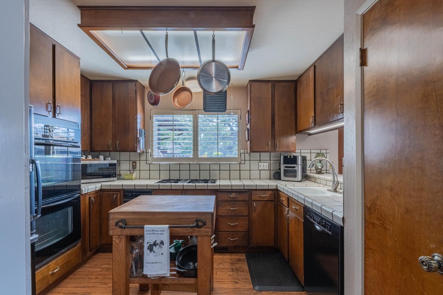 14190 Reservation Road Salinas, CA 93908 - Photo 12 of 34 a kitchen with a sink cabinets and window