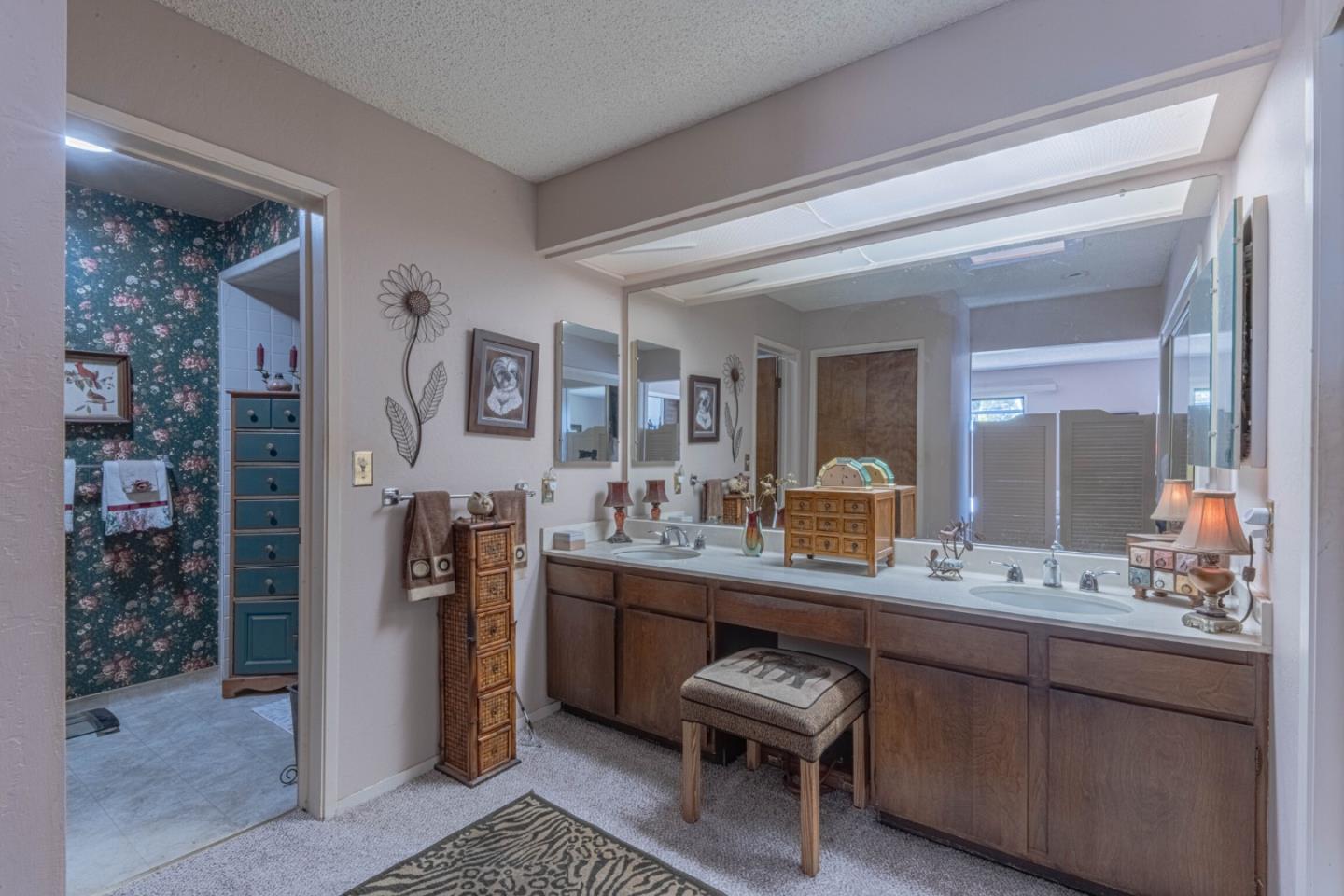 14190 Reservation Road Salinas, CA 93908 - Photo 19 of 34 a bathroom with a sink a mirror a vanity and a shower