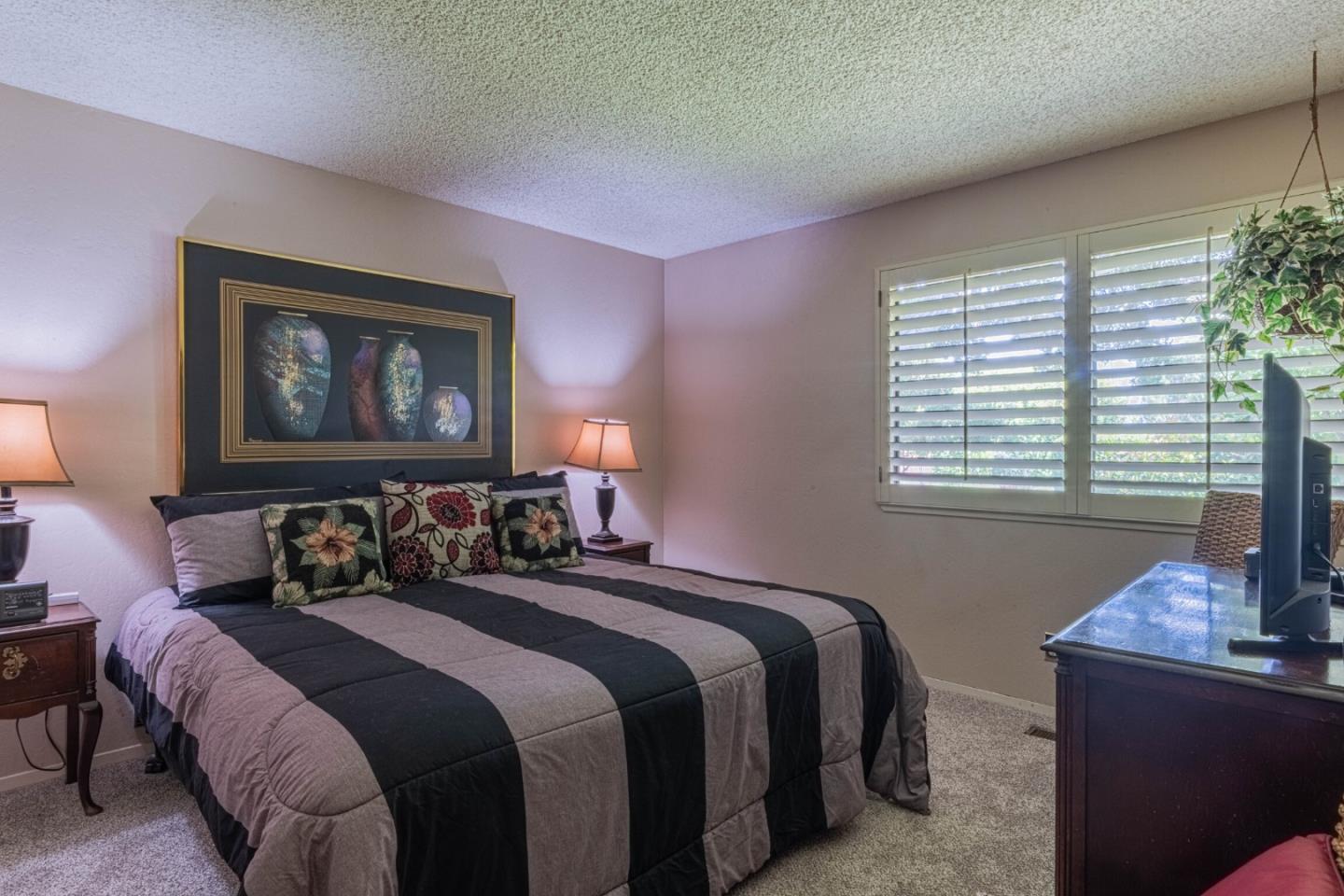 14190 Reservation Road Salinas, CA 93908 - Photo 21 of 34 a bedroom with a bed and a window