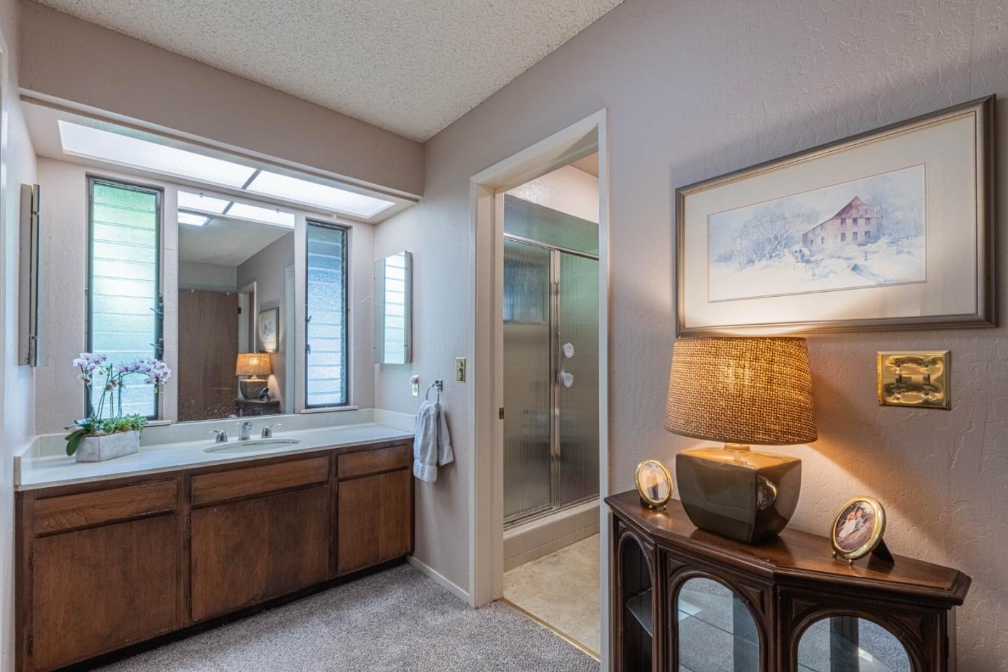 14190 Reservation Road Salinas, CA 93908 - Photo 23 of 34 a bathroom with a granite countertop sink mirror and double