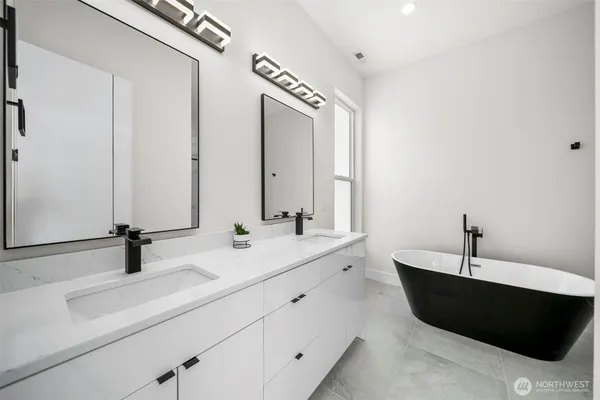 a bathroom with a bathtub and a sink