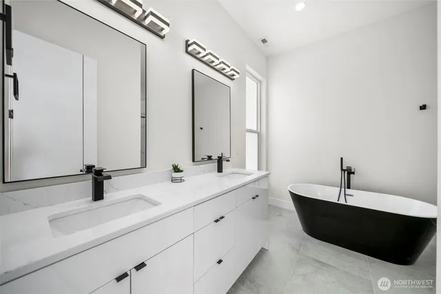 a bathroom with a bathtub and a sink