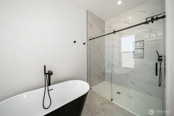 a bathroom with a shower and a bathtub