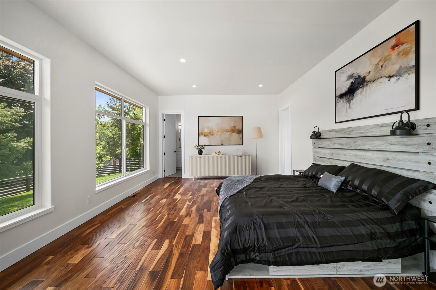83 Summerset Boulevard Manson, WA 98831 - Photo 32 of 40 a bedroom with a bed and wooden floor
