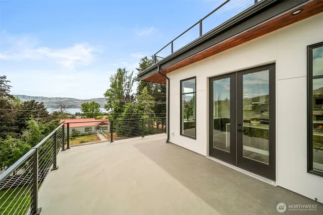 a view of a patio with a table and chairs