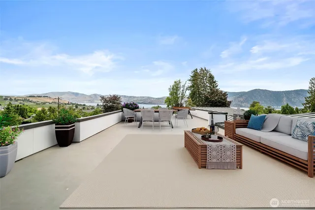 a balcony with furniture and city view