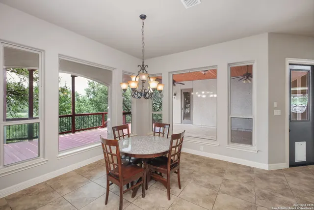 a view of a dining room with furniture window and outside view