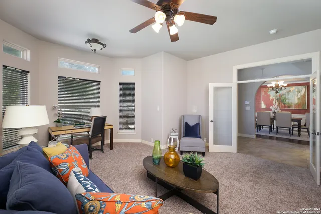 a living room with furniture and a large window