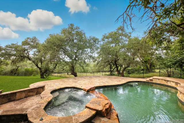 a view of swimming pool with a yard