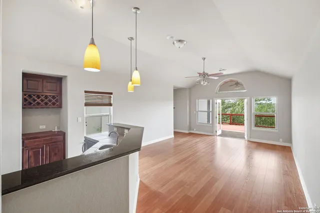a view of a room with wooden floor and outdoor space