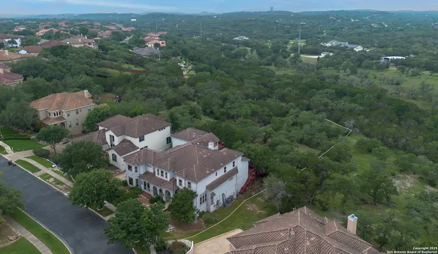 an aerial view of a house with a garden