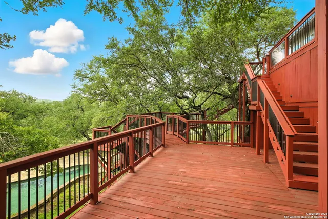 a view of a balcony with wooden floor