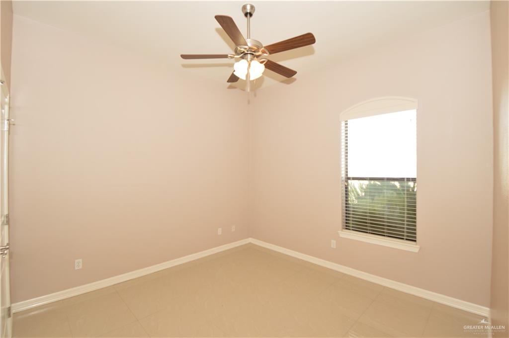 2705 Mimosa Street, Unit 2 Mission, TX 78574 - Photo 19 of 27 Unfurnished room with ceiling fan and light tile patterned floors