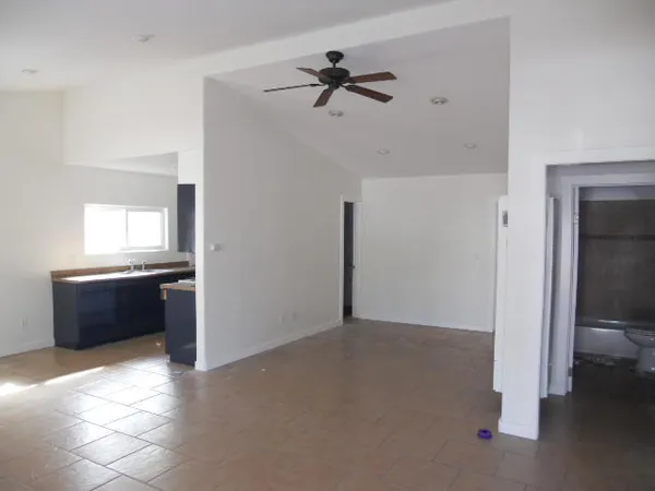 a kitchen that has a sink and a stove in it