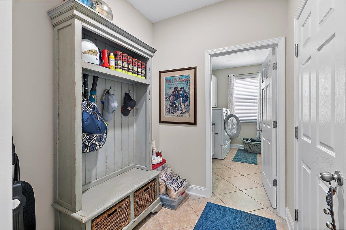 331 Athens Drive St. Augustine, FL 32092 - Photo 14 of 24 a view of a hallway with workspace and a living room