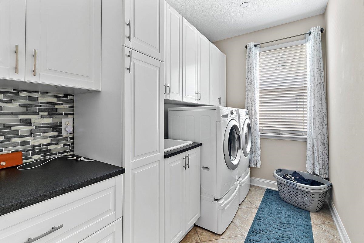 331 Athens Drive St. Augustine, FL 32092 - Photo 15 of 24 a storage room with washer and dryer