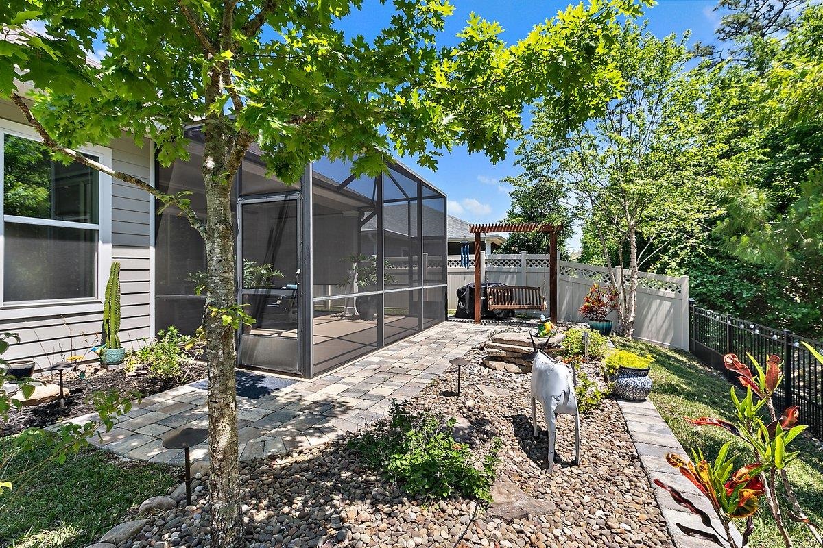 331 Athens Drive St. Augustine, FL 32092 - Photo 17 of 24 a view of a dinning table and chairs in patio