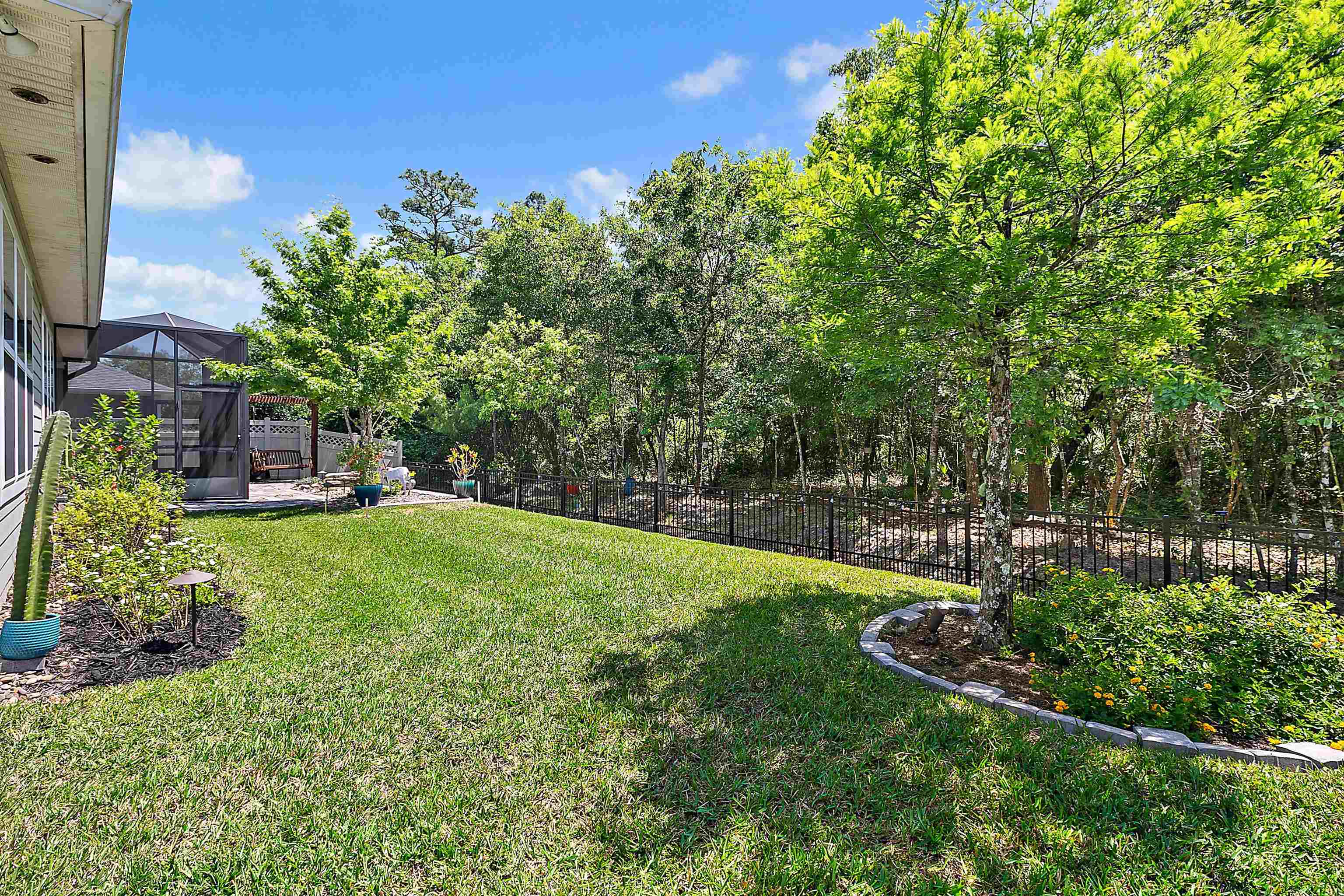 331 Athens Drive St. Augustine, FL 32092 - Photo 18 of 24 a view of a garden with a building in the background
