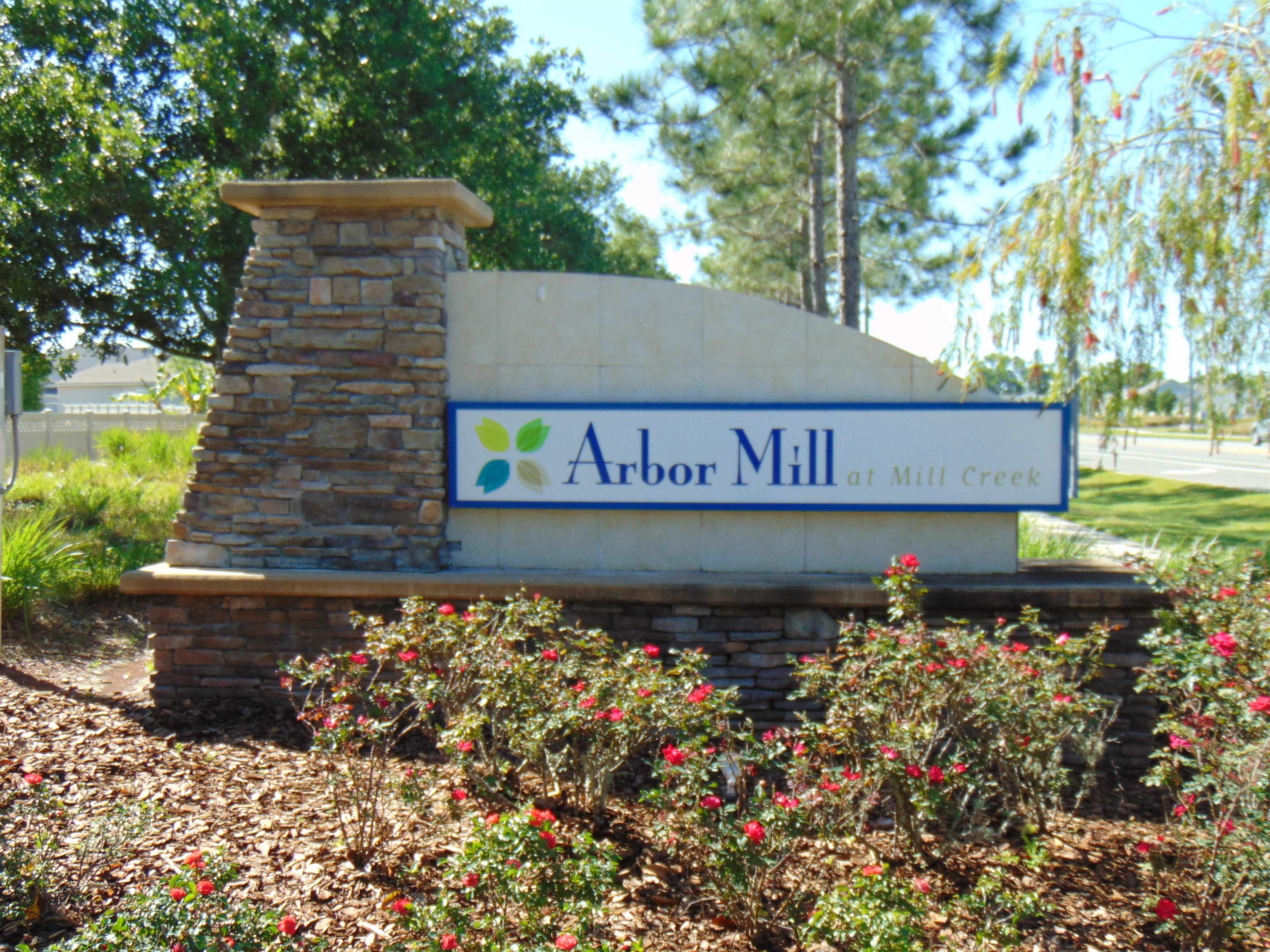 331 Athens Drive St. Augustine, FL 32092 - Photo 19 of 24 a street sign that is sitting in front of flowers