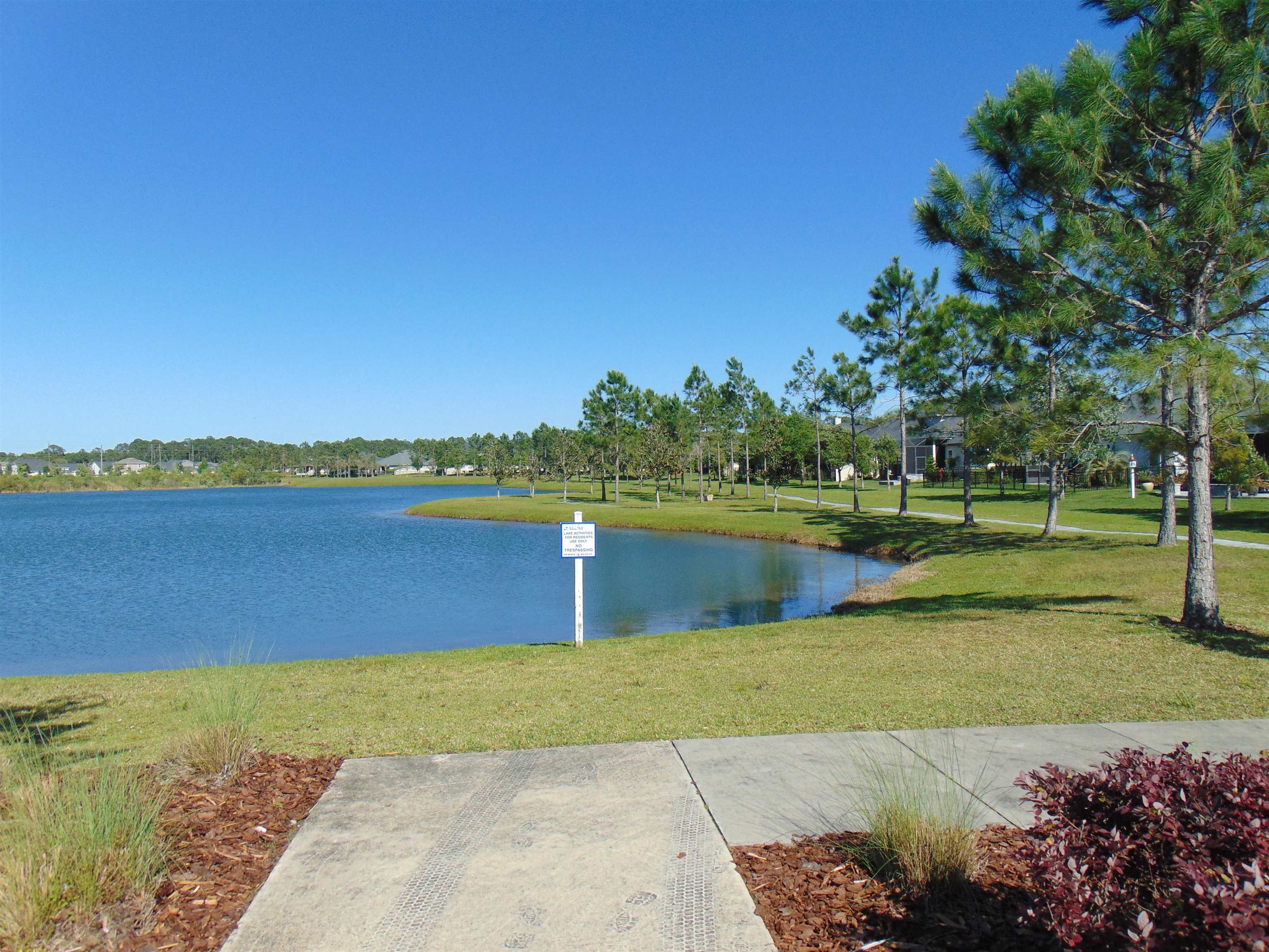 331 Athens Drive St. Augustine, FL 32092 - Photo 22 of 24 a view of a lake with houses in the background