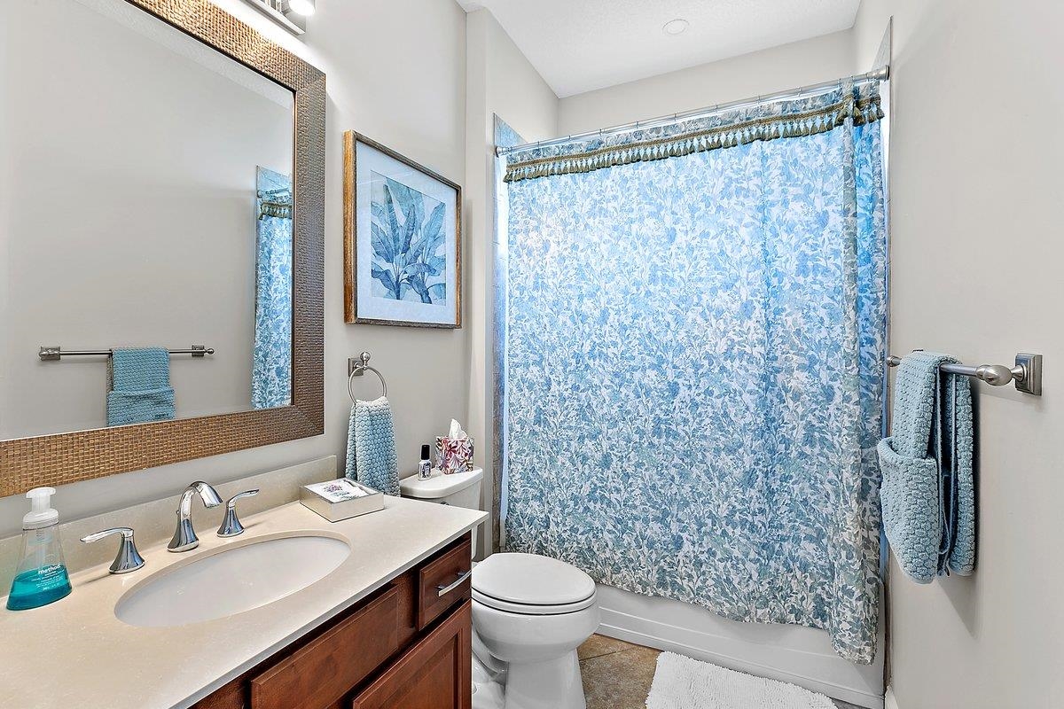 331 Athens Drive St. Augustine, FL 32092 - Photo 9 of 24 a bathroom with a sink toilet and shower