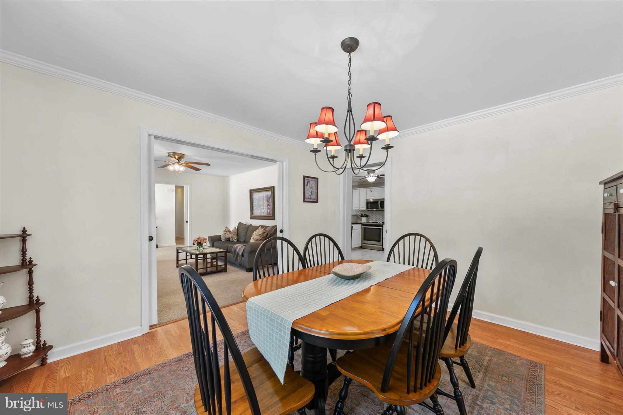 24618 Peterkins Road Georgetown, DE 19947 - Photo 16 of 47 a dining room with furniture and wooden floor