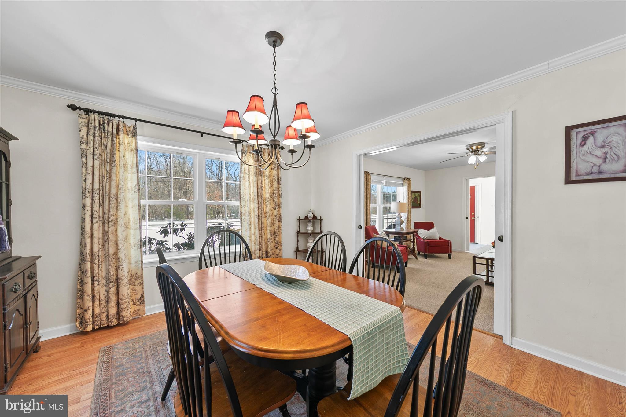 24618 Peterkins Road Georgetown, DE 19947 - Photo 17 of 47 a view of a dining room and a table chairs