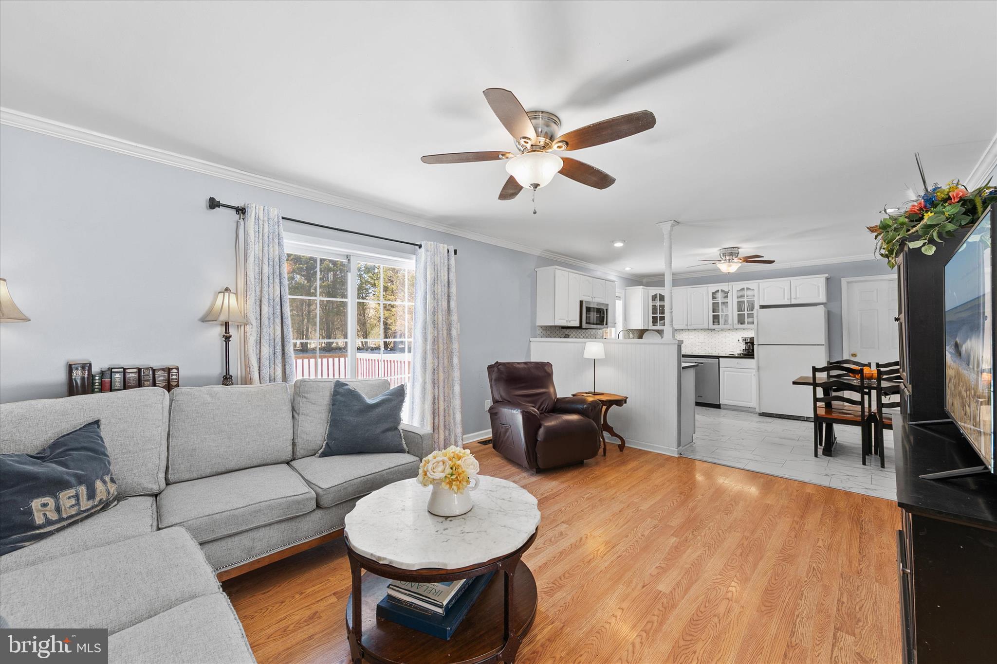 24618 Peterkins Road Georgetown, DE 19947 - Photo 19 of 47 a living room with furniture and a large window