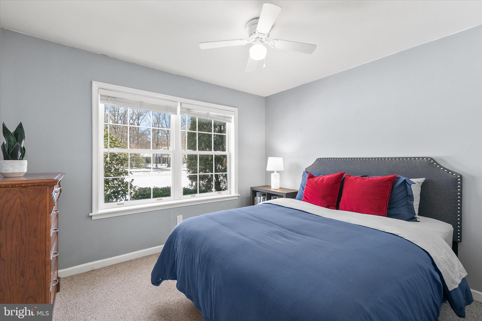 24618 Peterkins Road Georgetown, DE 19947 - Photo 34 of 47 a bedroom with a large bed and a window