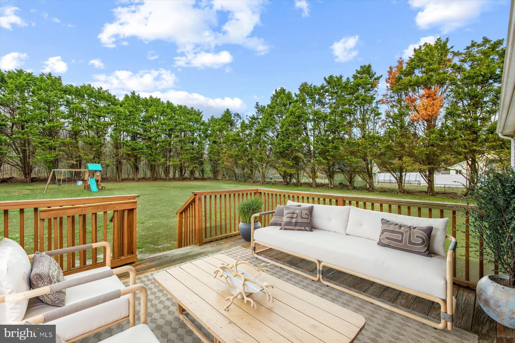24618 Peterkins Road Georgetown, DE 19947 - Photo 42 of 47 a view of deck with couches and wooden floor