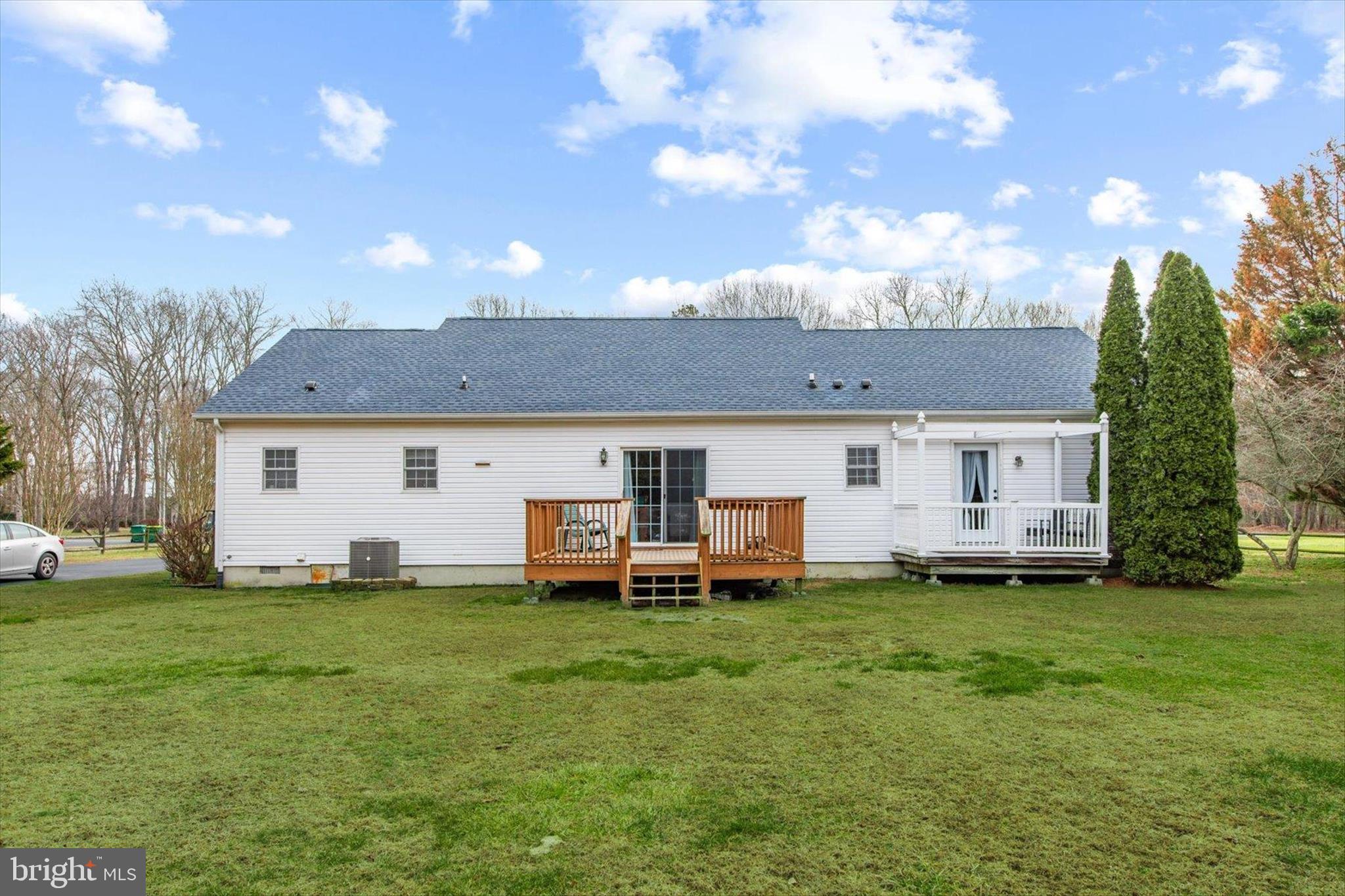 24618 Peterkins Road Georgetown, DE 19947 - Photo 47 of 47 a view of a house with a backyard and a tree